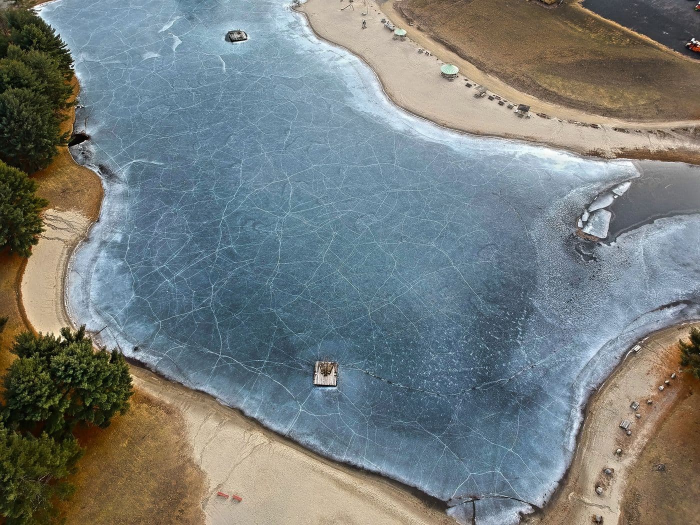 The frozen lake and snowy beach from above
